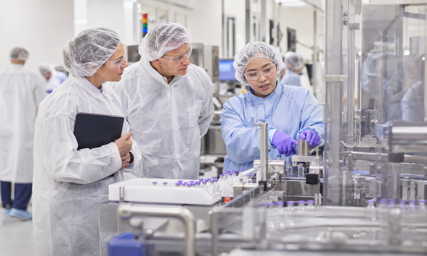 Auditor and site team observing a manufacturing process