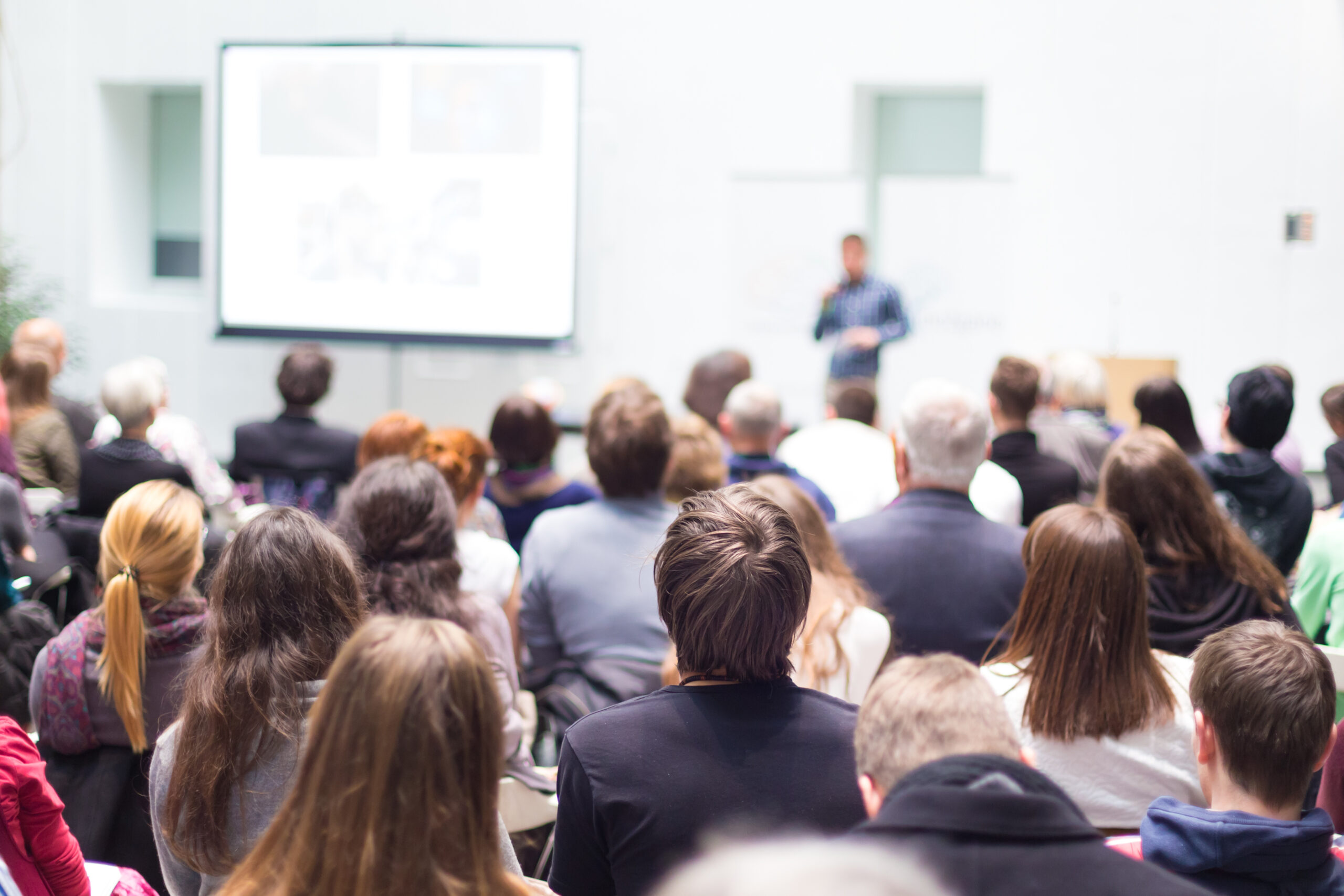 Audience attending a presentation